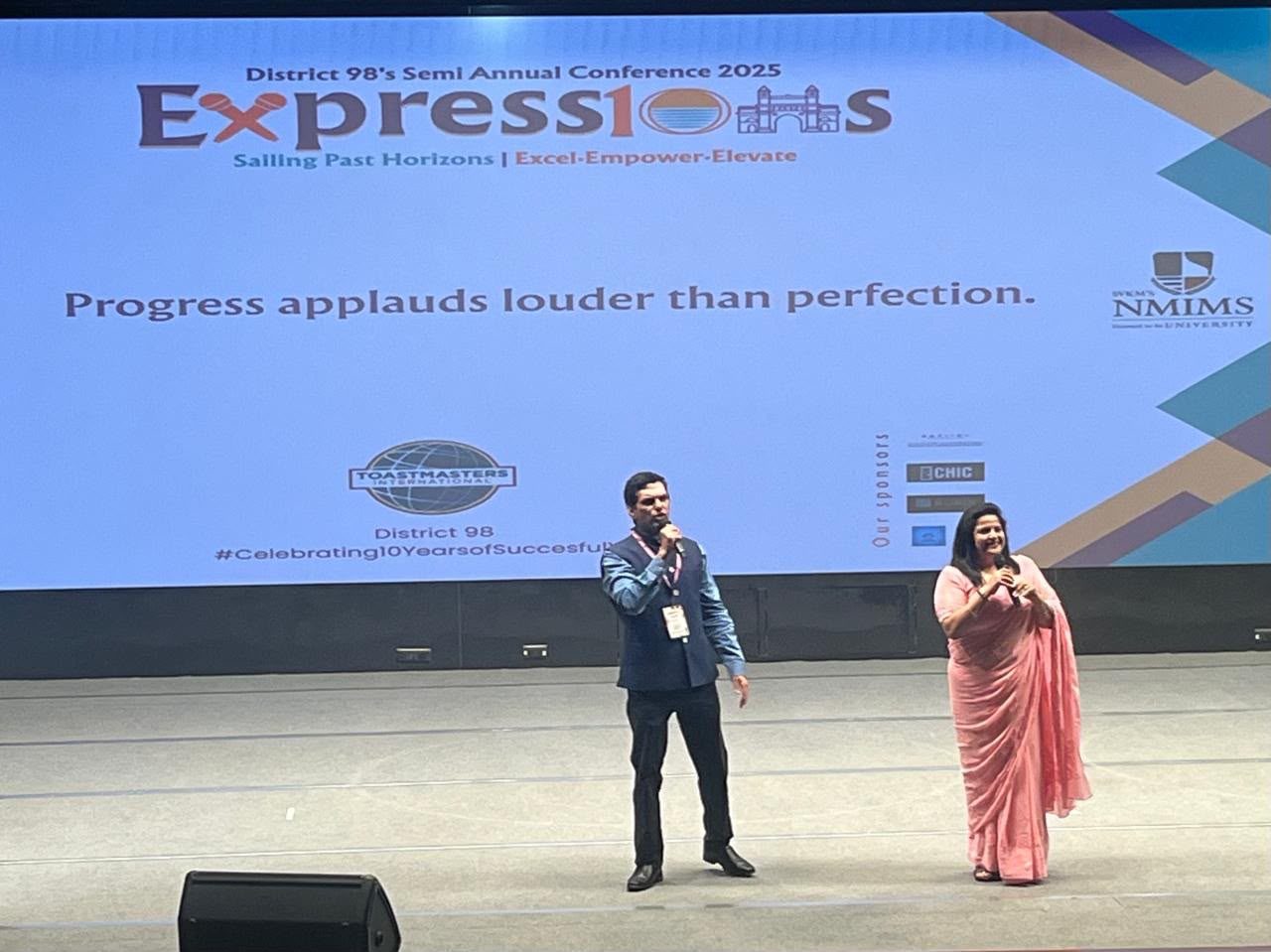 Shipra sharing a conference stage with another speaker